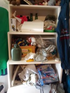 My son and I actually took a picture of his closet before he cleaned it. The one great feature that our other closets have that this one didn't is that when you open them, something might fall on your head. It makes for suspenseful living!